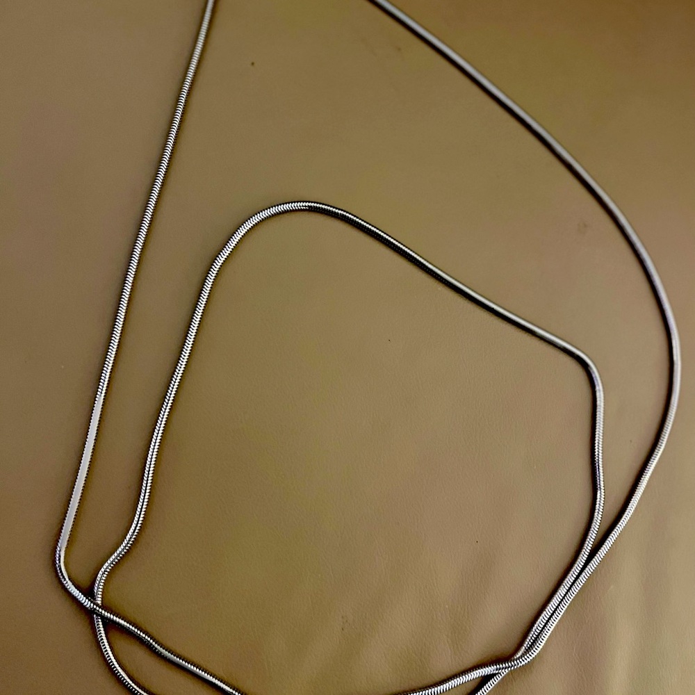 Vintage Monet bright silver tone 54-inch (27-inch when clasped) necklace